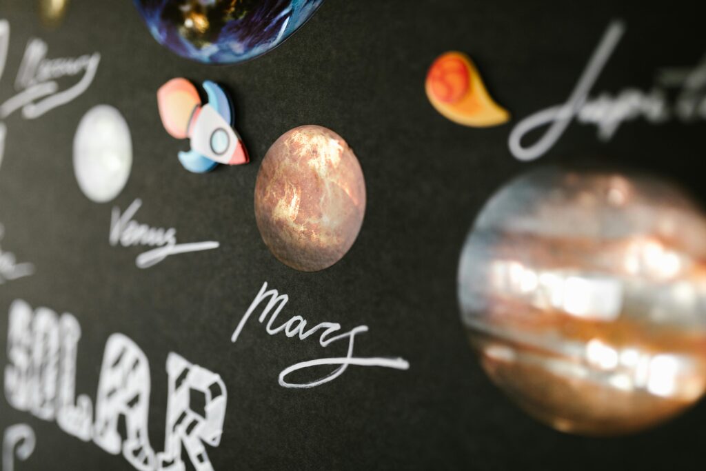 Creative depiction of the solar system planets for school project on a dark background.